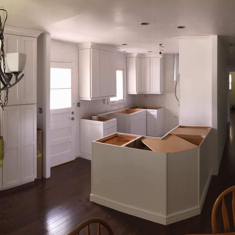 Kitchen remodeling: new cabinets installed, countertops not yet installed.