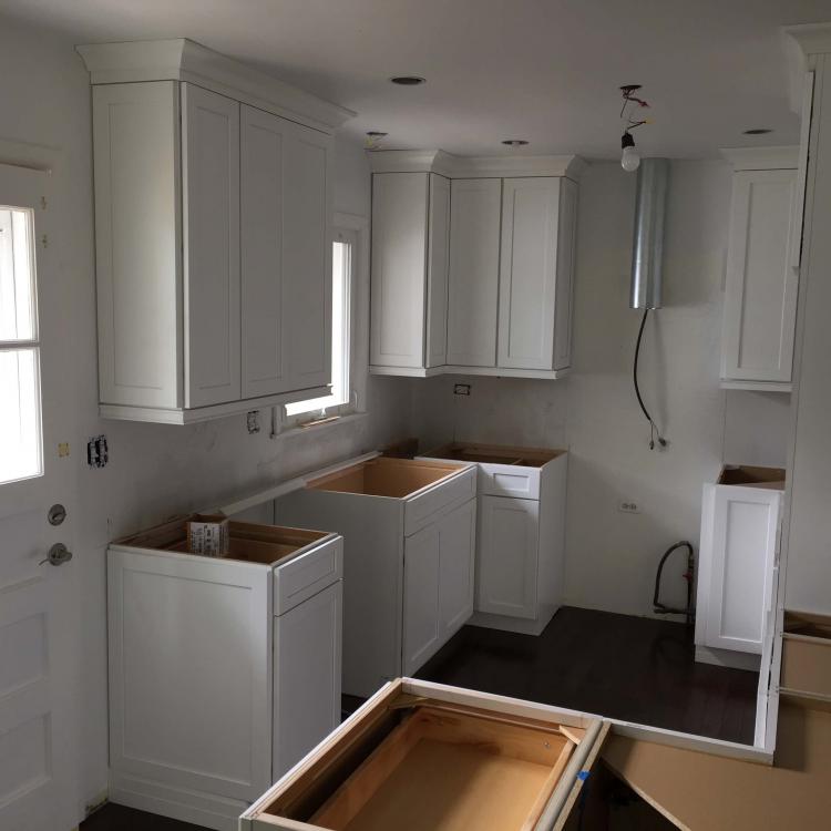 Kitchen remodeling: white cabinets installed, countertops not yet installed