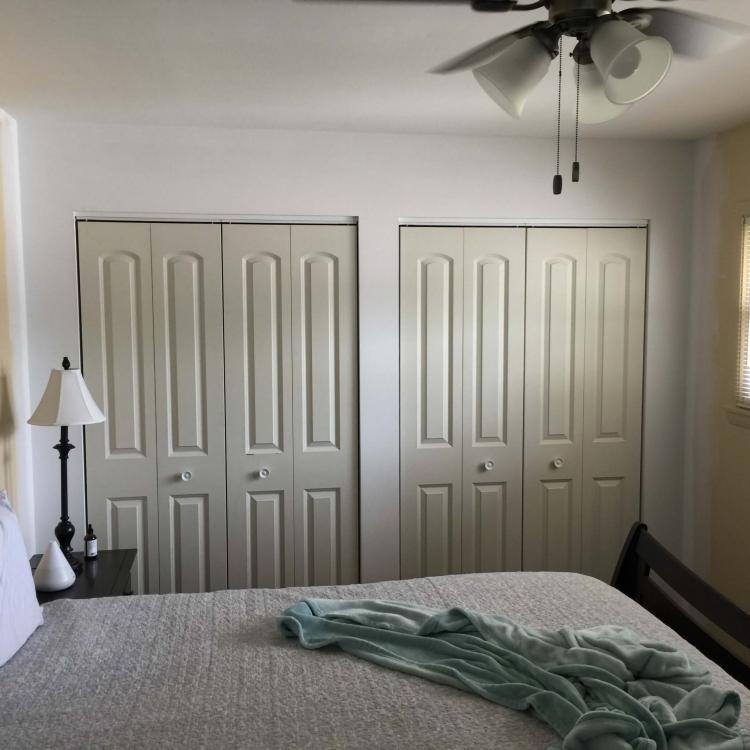 Bedroom with freshly painted walls and new closet doors