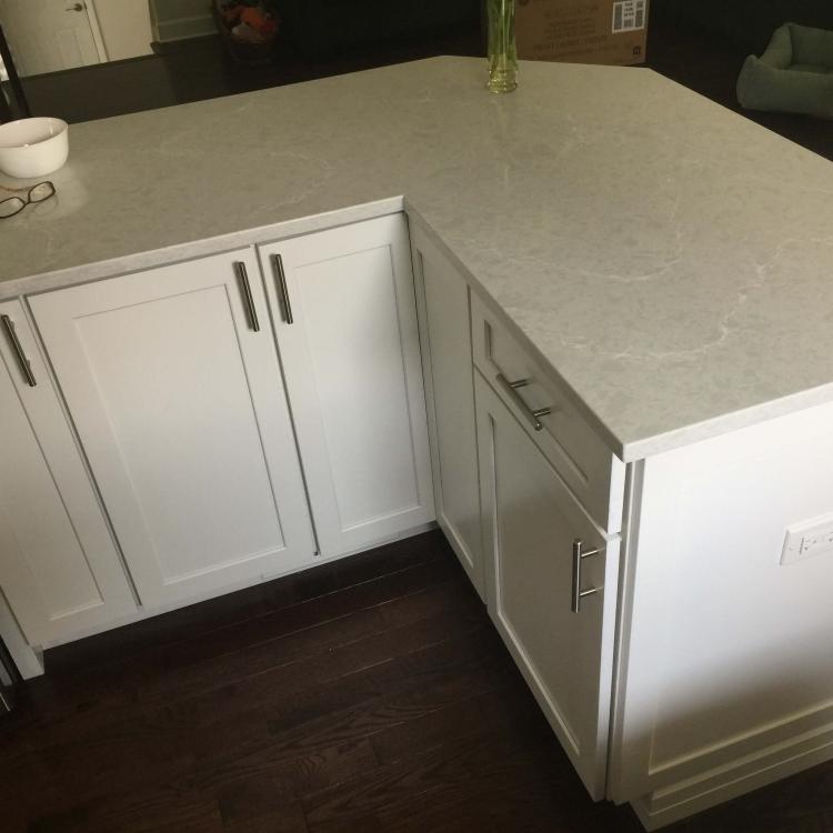 Kitchen countertop detail: white cabinets and quartz countertop