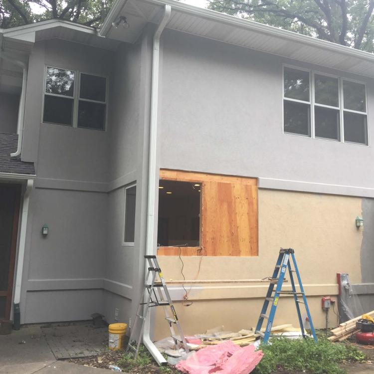 Double-hung window replacement in progress.