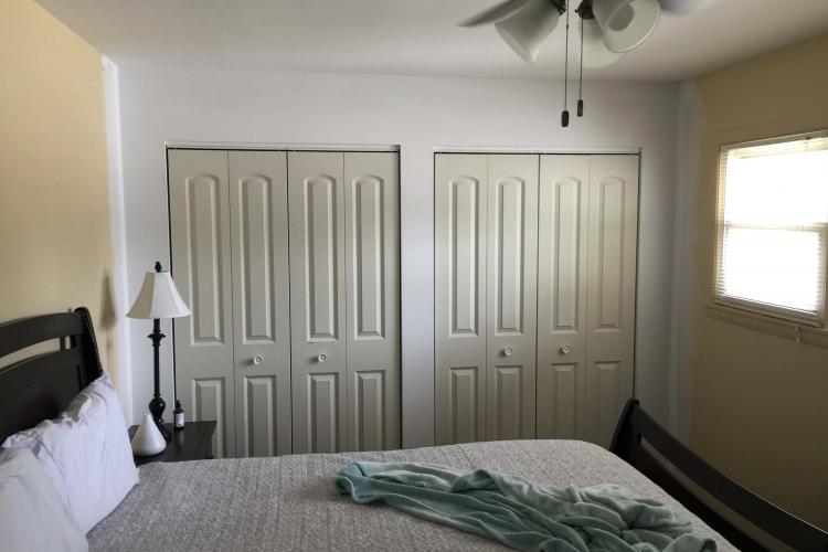 Bedroom with freshly painted walls and new closet doors