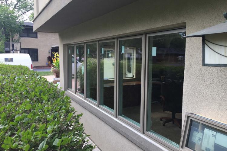 A modern window replacement project featuring a multi-pane sliding window.