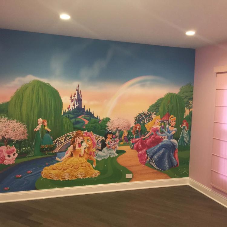 Child's bedroom with princess custom printed mural on the wall.