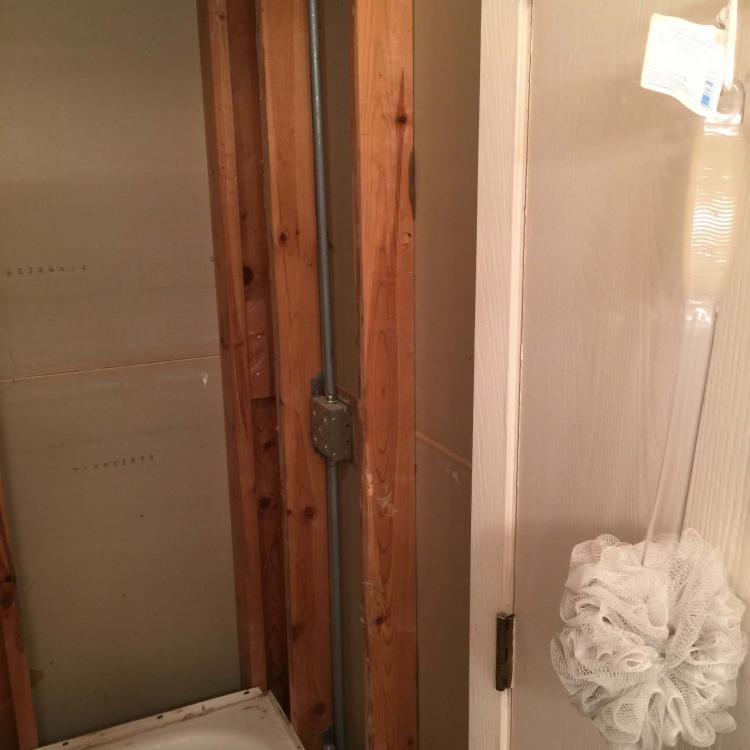 Bathroom renovation in progress: removed wall