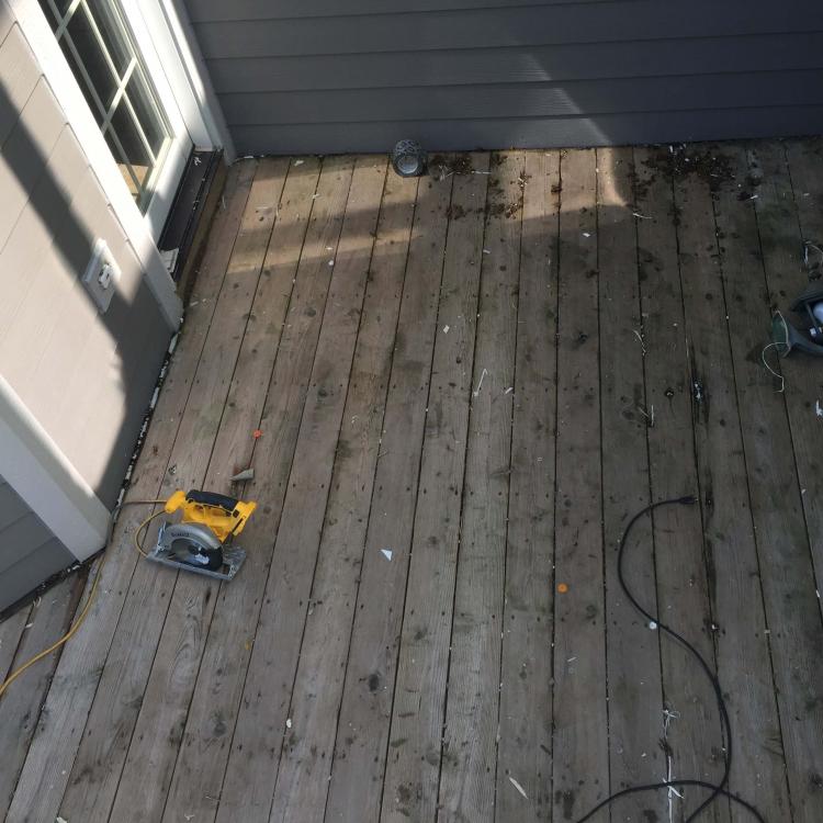 Home renovation project: Deck repair and replacement underway.