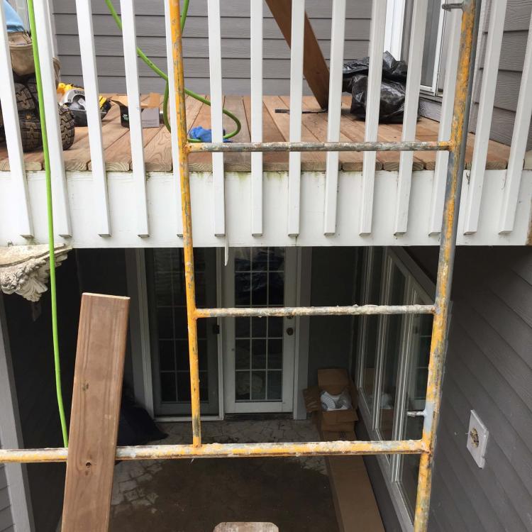 Home renovation: Deck repair and replacement stage.