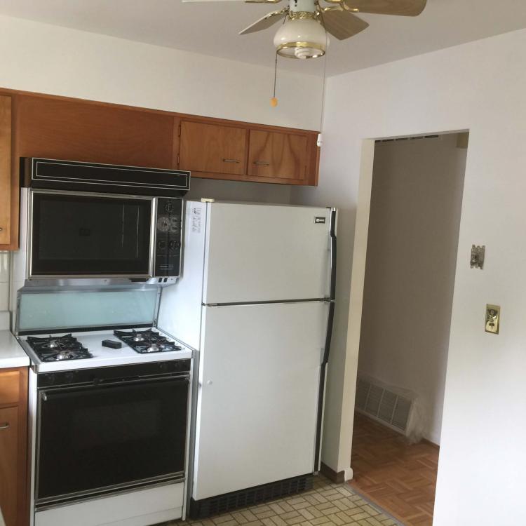 Kitchen with wood cabinets and appliances