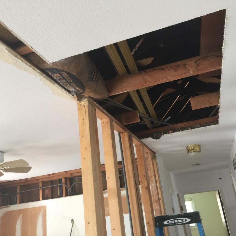 Mid-stage ceiling renovation, showcasing the potential for interior design transformations