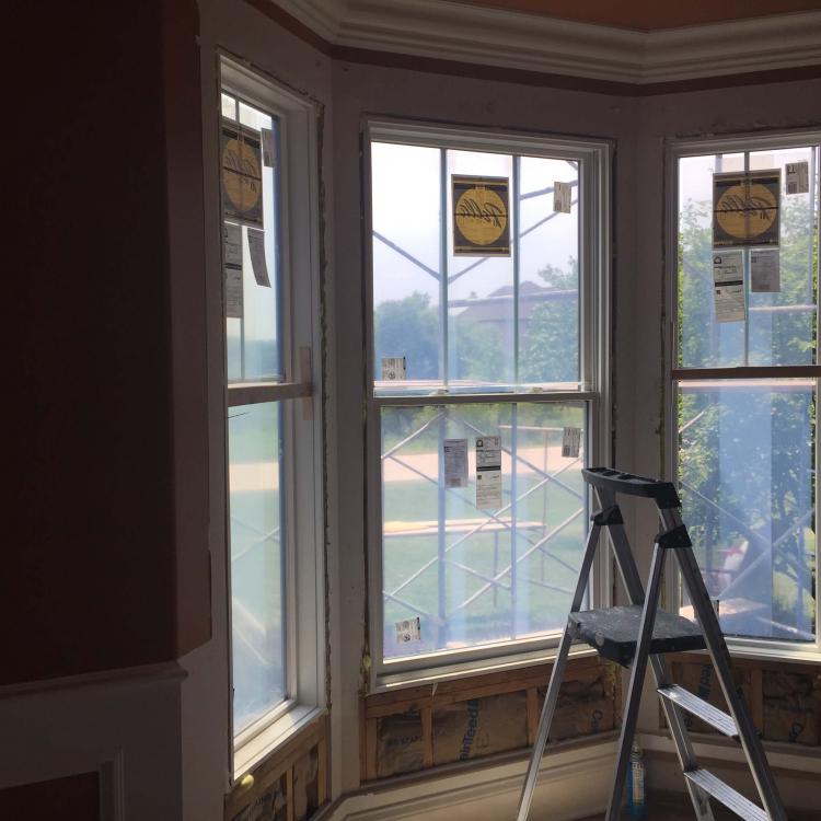 Window replacement in progress: New bay window being installed.