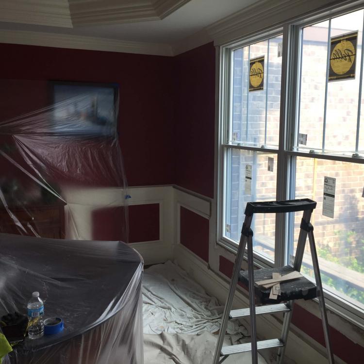 Home renovation: Window replacement stage. New windows being installed in a dining room.