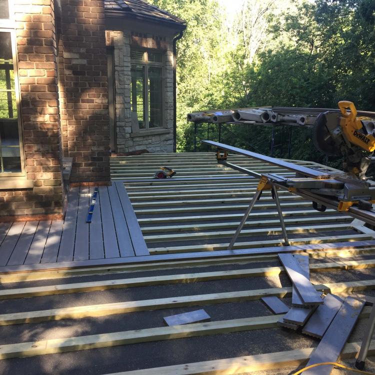 A deck under construction with scaffolding,