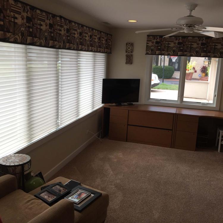 Interior view of a room with newly installed windows with blinds